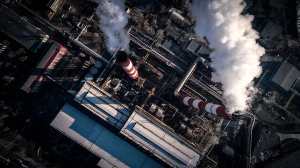 Air pollution by smoke coming out of two factory chimneys. Aerial view — Stock Photo, Image