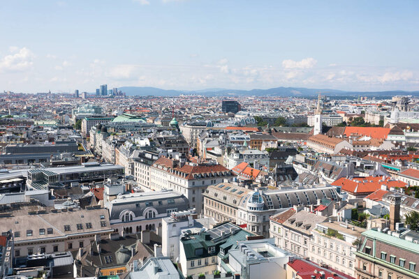 Panoramic view of the city from the viewing platform of the Tower of St. Stephens Cathedral in Vienna, Austria. View of the modern city center with modern architecture.
