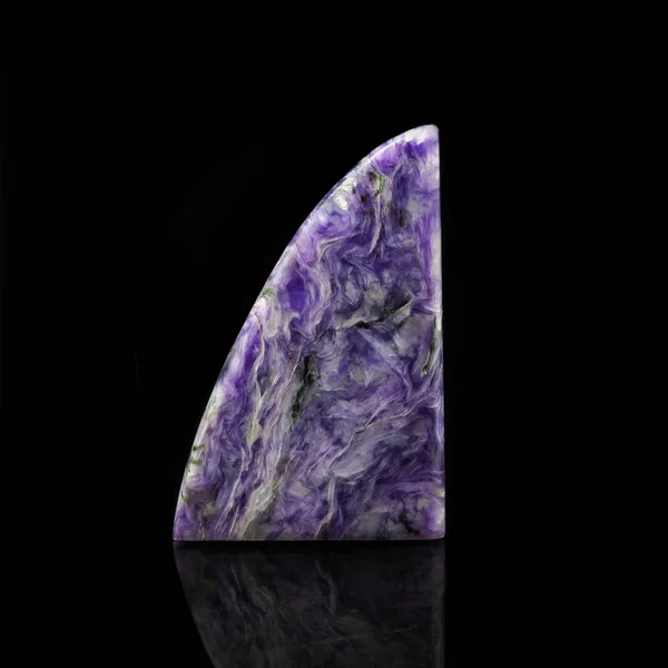 Russian charoite on a black background — стокове фото