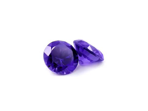 Pedras preciosas violetas em um fundo branco — Fotografia de Stock