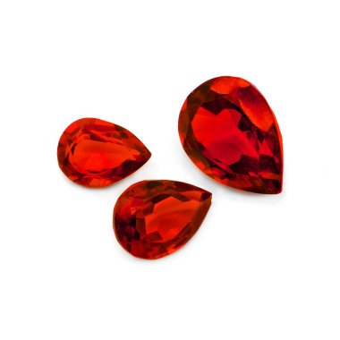 Three red gems on a white background. Pear facet red gemstones. clipart