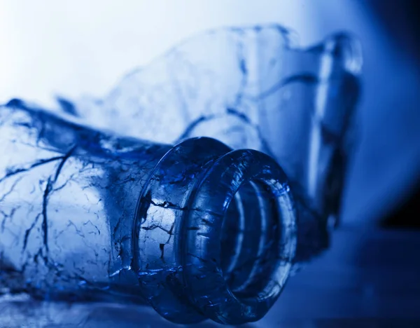 broken glass bottle in blue light