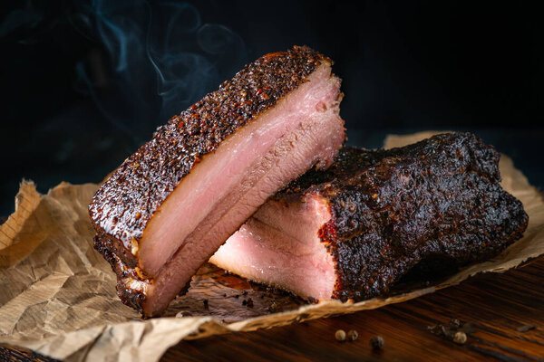 Sliced smoked pork brisket with dark crust from classic Texas smokehouse