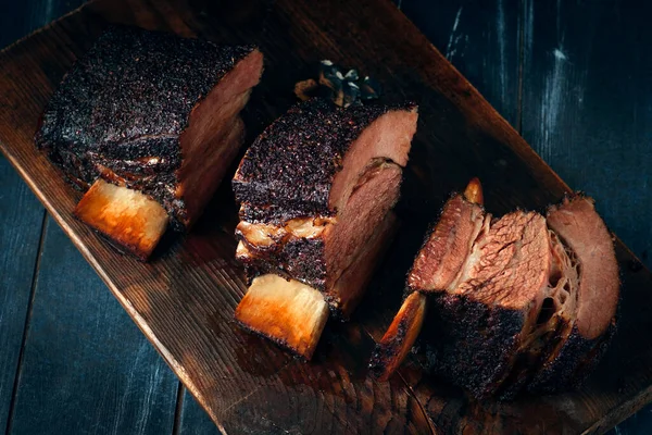 Chopping board with Smoked beef brisket ribs, Classic Texas BBQ