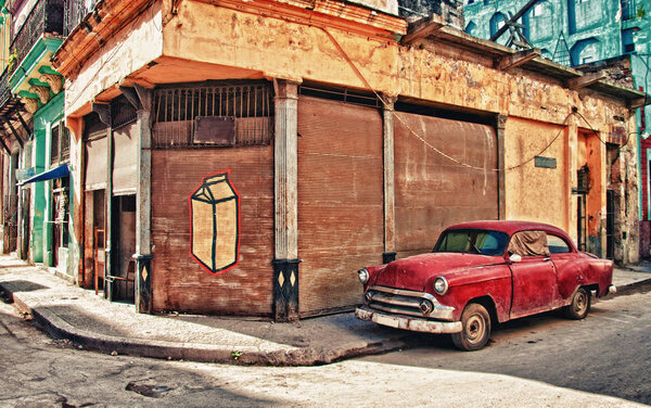 old car parked on the street of habana