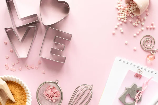 Frame of food ingredients for baking on a gently pink pastel background. Cooking flat lay with copy space. Top view. Baking concept. Valentine's Day. flat lay