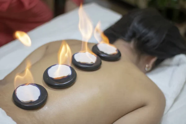 Back massage with hot stones, thai therapy — Stock Photo, Image
