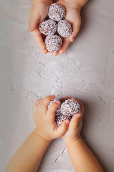 children holding energy balls in hands, flat lay and copy space