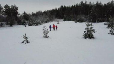 A group of tourists is on the trail. Back view