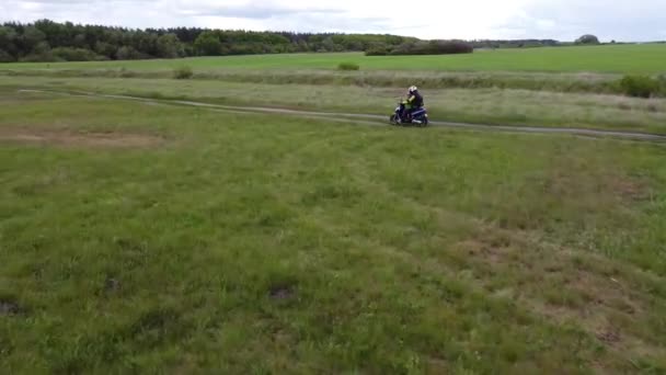 Girl Child Riding Moto Scooter Motorcycle Dirt Road Fields Aerial — Stock Video