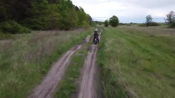 Girl Riding Moto Scooter Motorcycle Dirt Road Field Forest Aerial — Stock Video