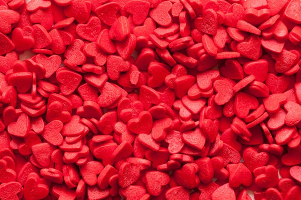 赤いキャンディーの心 愛の背景 トップビュー — ストック写真