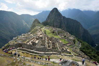 Tourists walk in Machu Picchu site clipart