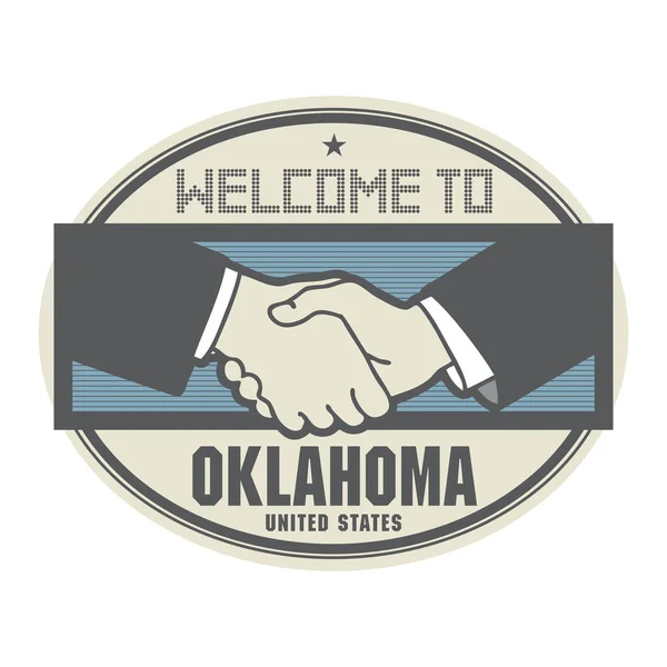 Bedrijfsconcept met handdruk en de tekst welkom in Oklahoma — Stockvector