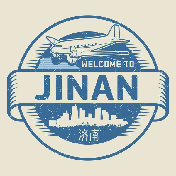 Grunge sello de goma o etiqueta con texto Bienvenido a Jinan — Archivo Imágenes Vectoriales