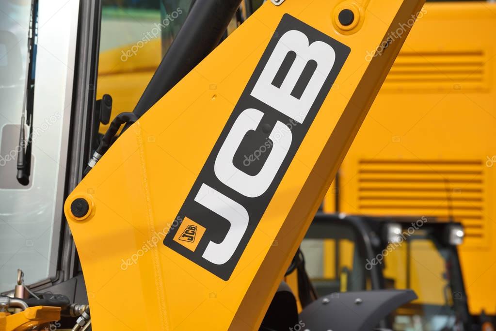 VILNIUS, LITHUANIA - APRIL 27: JCB heavy duty equipment vehicle and logo on April 27, 2017 in Vilnius, Lithuania. JCB corporation is manufacturing equipment for construction and agriculture.