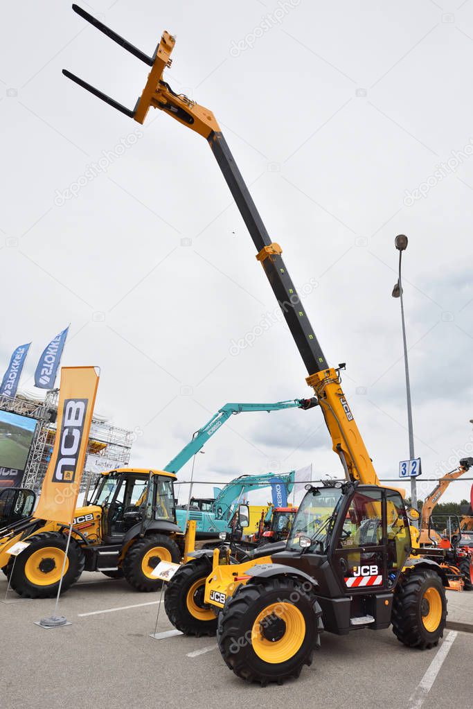 VILNIUS, LITHUANIA - APRIL 27: JCB heavy duty equipment vehicle and logo on April 27, 2017 in Vilnius, Lithuania. JCB corporation is manufacturing equipment for construction and agriculture.