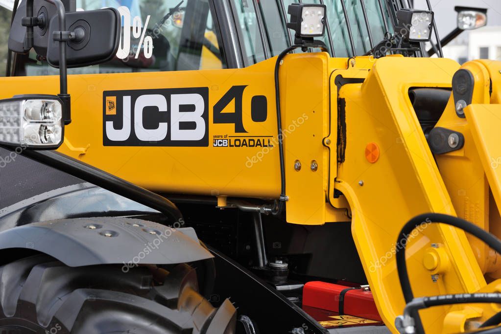 Kaunas, Lithuania - March 23: JCB heavy duty equipment vehicle and logo on March 23, 2018 in Kaunas, Lithuania. JCB corporation is manufacturing equipment for construction and agriculture.