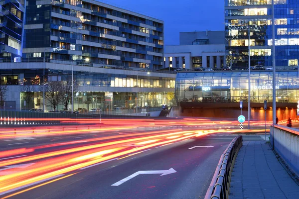 Modern office buildings and night traffic — Stock Photo, Image