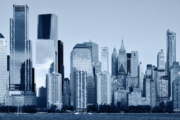Manhattan Skyline over Hudson river, New York City, Black and white blue toned image