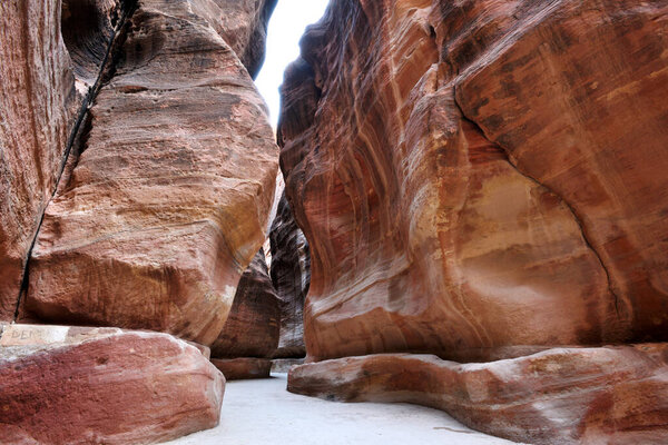 Narrow passage of rocks of Petra Canyon in Wadi Musa, Jordan
