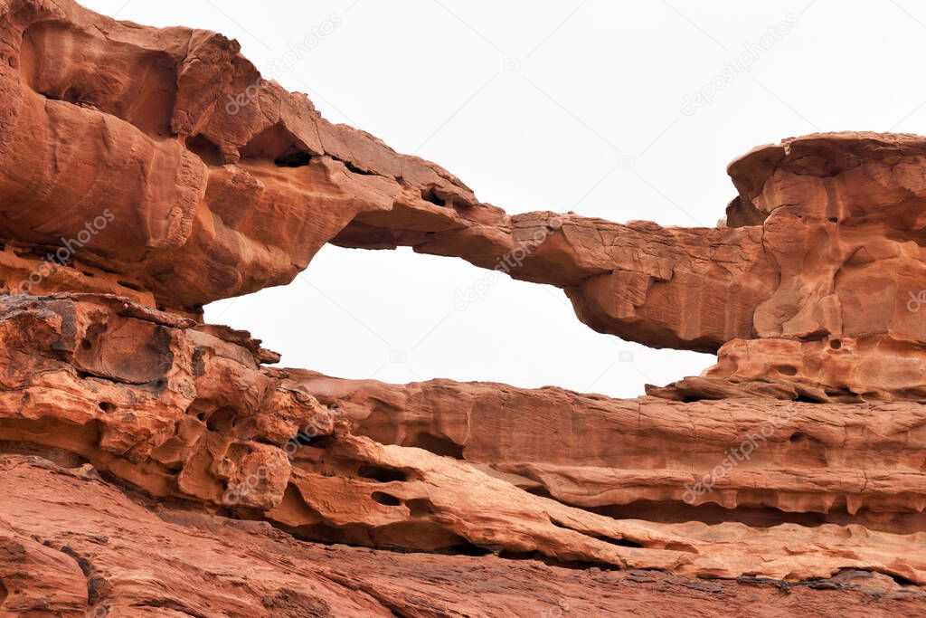 Natural arch in Wadi Rum rock desert. Wadi Rum is a valley cut into the sandstone and granite rock in southern Jordan