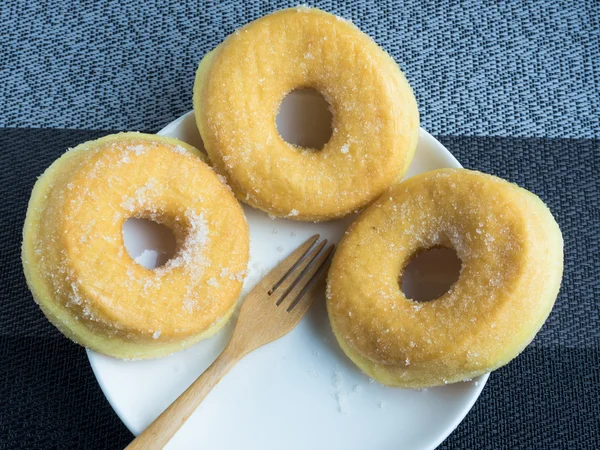 Sugary donuts on a white plate. — Stock Photo, Image