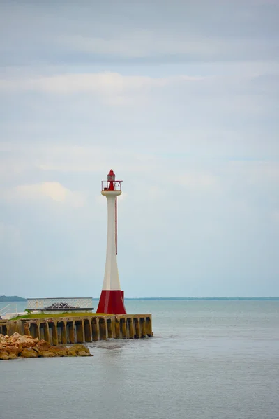 Red lighthouse on a cloudy day — Stock Photo, Image