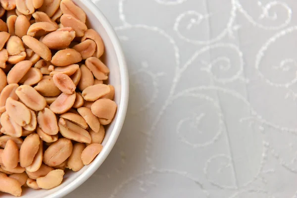 Peanut bowl on the table in natural light — Stock Photo, Image