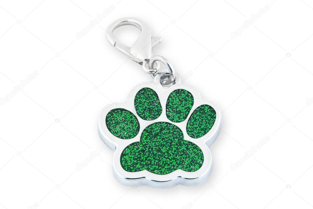 Closeup dog collar metal tag shaped in form footprint isolated on white background. Footprint clip collar accessory, leash charm footprint accessory, ID tag animal.