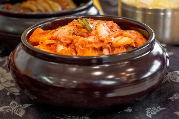 KimchiKimchi in a special pot. Dish of national Korean cuisine for long-term storage of cabbage with hot red pepper — стокове фото