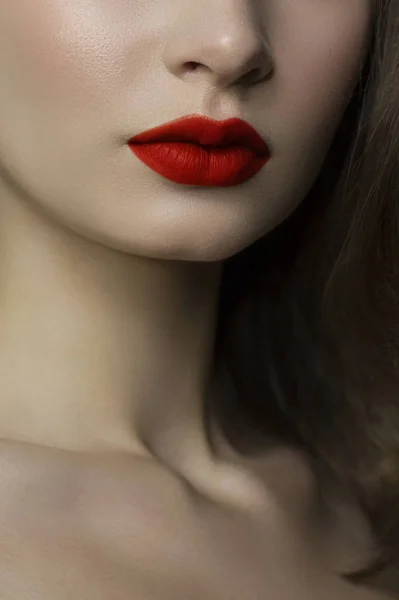 Sexual full lips. Natural gloss of lips and woman\'s skin. The mouth is closed. Increase in lips, cosmetology. red lips. Great summer mood with open eyes. fashion jewelry. pink lip gloss