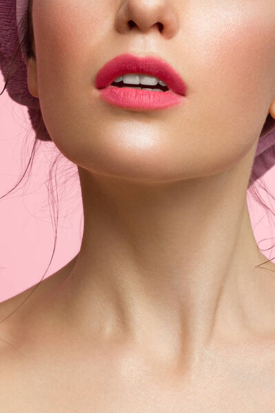 Close-up perfect lip makeup beautiful female mouth. Plump sexy full lips. Macro photo face detail. Perfect clean skin, fresh lip make-up. Sweet pink lipstick, magenta color. Valentine's day style