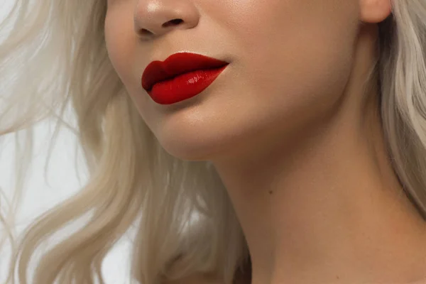 Closeup plump Lips. Lip Care, Fillers. Macro photo with Face detail. Natural shape with perfect contour. Close-up perfect natural lip makeup beautiful female mouth. Plump sexy full red lips