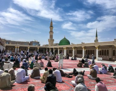 Muslims gathered for worship Nabawi Mosque, Medina, Saudi Arabia clipart