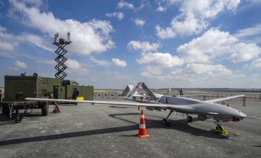 ISTANBUL, TURKEY - SEPTEMBER 22, 2018: Bayraktar, a medium-altitude long-endurance unmanned aerial vehicle (UAV) stands on airport in Istanbul, Turkey. The aviation and technology festival, Teknofest. clipart