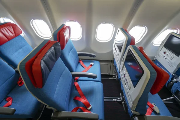 Aircraft interior. The passenger cabin of modern passenger airplane.