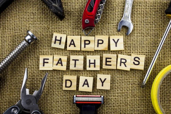 Happy Fathers Day message on a hessian jute background with frame of tools and ties. — Stock Photo, Image