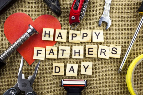Happy Fathers Day message on a hessian jute background with frame of tools and ties. — Stock Photo, Image