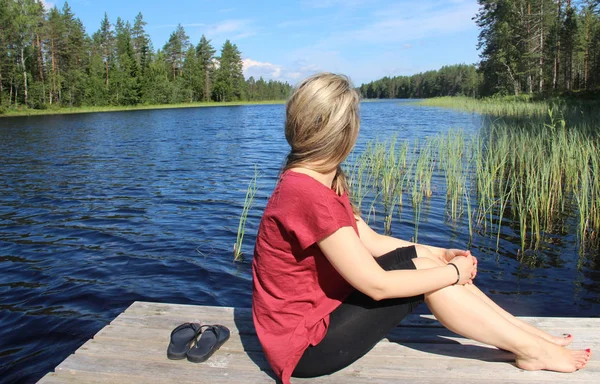 Young beautiful woman enjoy the nature of Finland