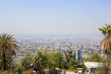 Santiago, Chile, View of the city from the San Cristobal hill. From the hill of San Cristobal opens an amazing panorama of Santiago - the city of St. James, the patron Saint of the Castilians. clipart