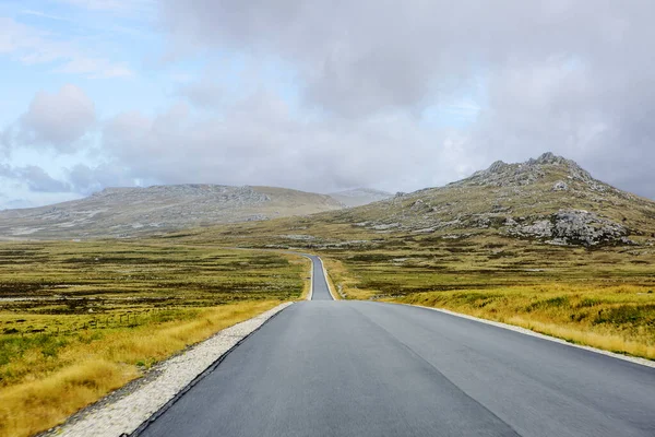 Port Stanley, Falkland Islands, United Kingdom, roads. Port Stanley is the administrative center and only city of the Falkland Islands, a British territory in the southwestern Atlantic ocean. The road to the coast with the penguins is just wonderful.