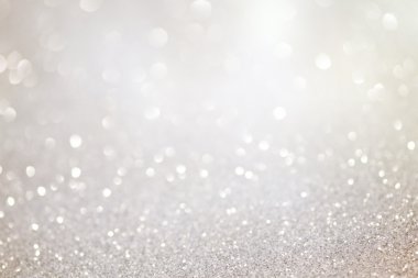 Silver glittering christmas lights. Blurred abstract background clipart