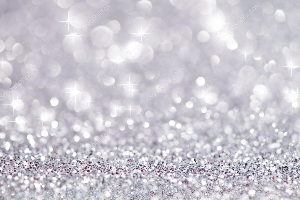 Silver glittering christmas lights. Blurred abstract background