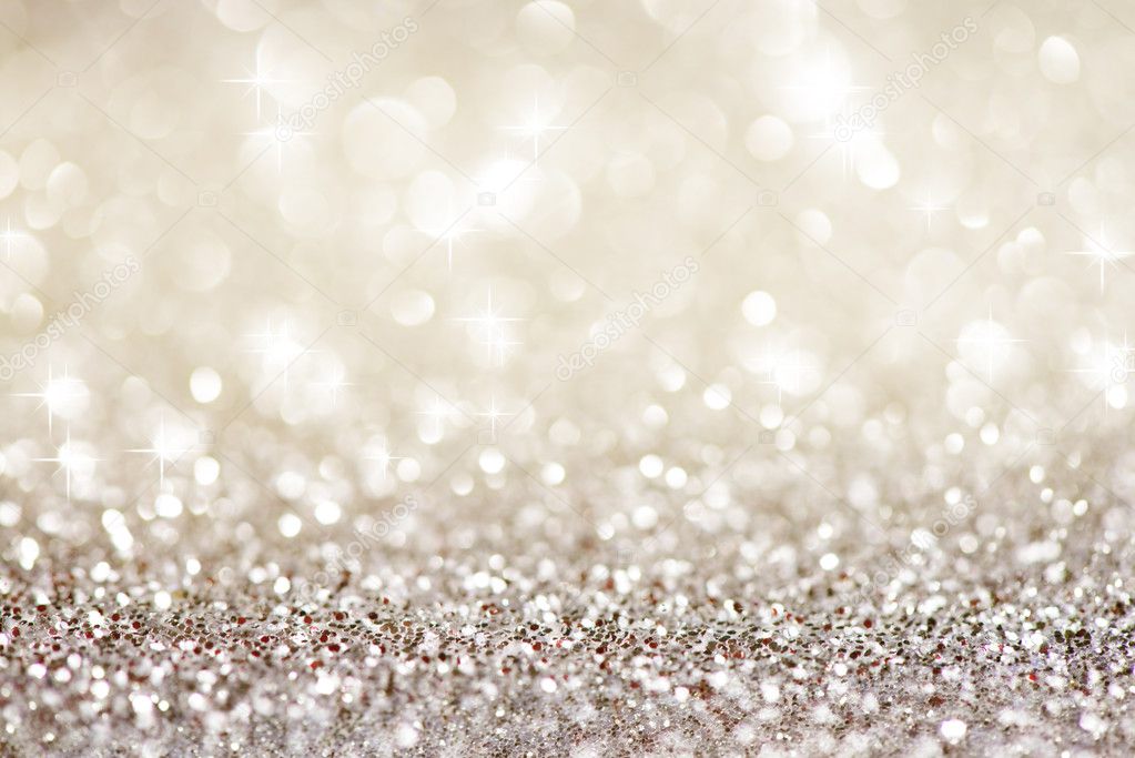 Silver glittering christmas lights. Blurred abstract background