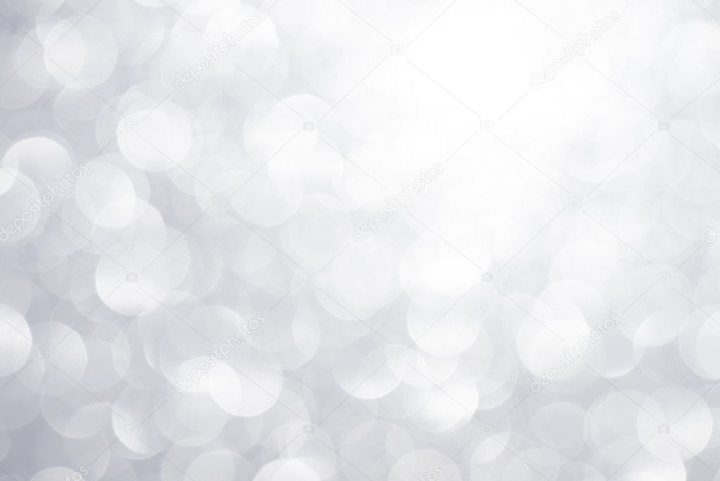 Silver glittering christmas lights. Blurred abstract background