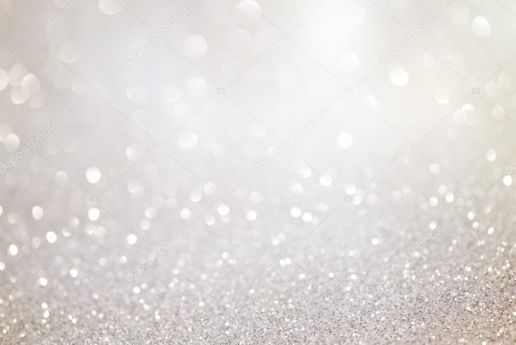 Silver glittering christmas lights. Blurred abstract background