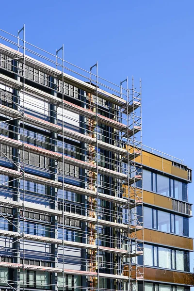 renovation of the facade of a multi storey house and thermal insulation using scaffolding