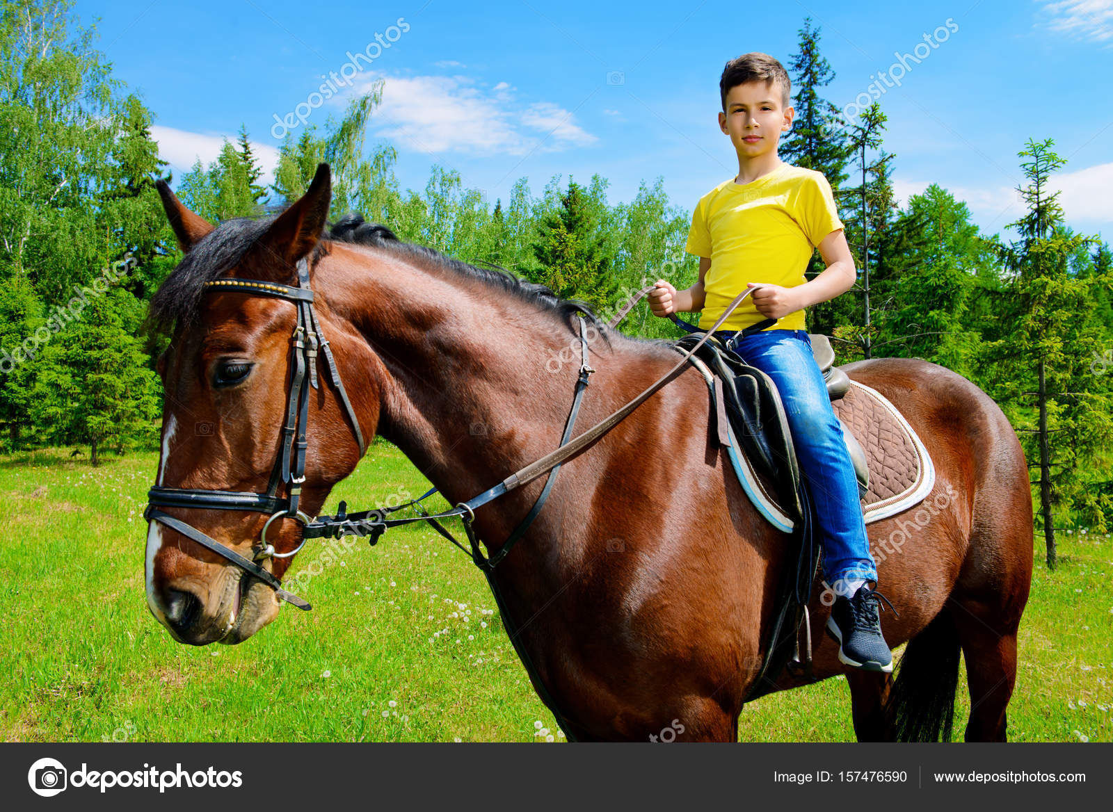 Lad riding a horse Stock Photo by ©prometeus 157476590