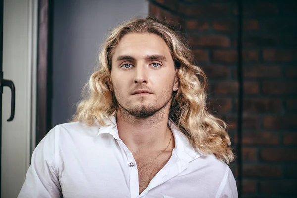 curly blond man